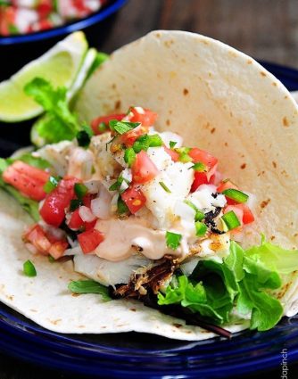 Fish Tacos Recipe - These fish tacos are so quick and easy and perfect for serving for a family supper or when entertaining! Made of flaky white fish, these fish tacos are a definite favorite!