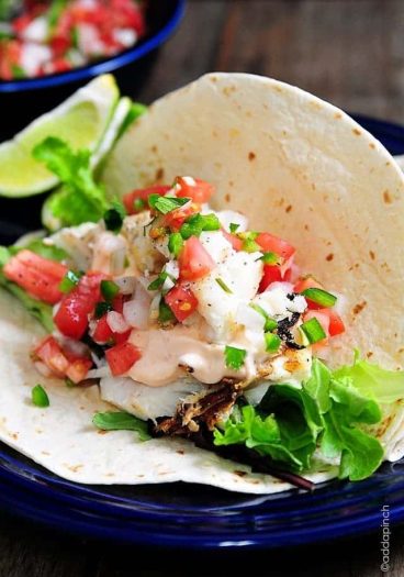 Fish Tacos Recipe - These fish tacos are so quick and easy and perfect for serving for a family supper or when entertaining! Made of flaky white fish, these fish tacos are a definite favorite!
