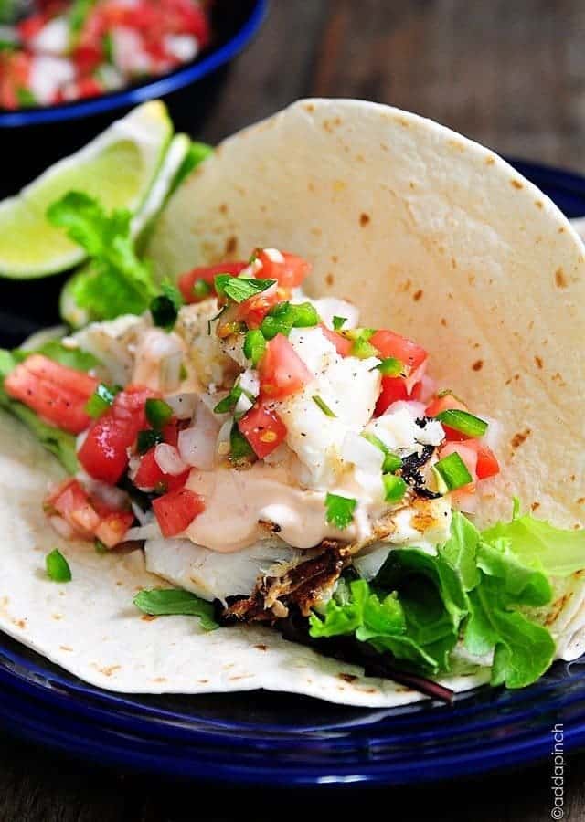 These fish tacos are so quick and easy and perfect for serving for a family supper or when entertaining! Made of flaky white fish, these fish tacos are a definite favorite!
