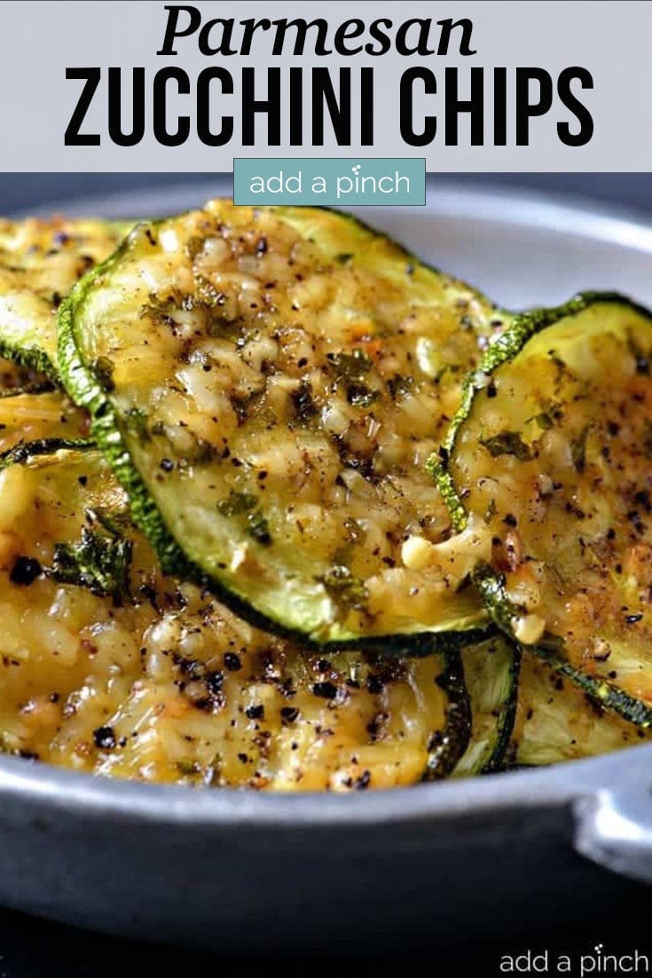 Parmesan Zucchini Chips are very thinly sliced and served in a white bowl - with text - addapinch.com