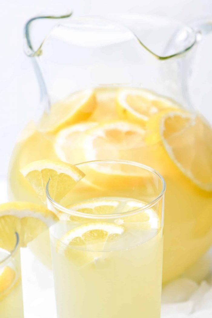 Lemonade Recipe - Refreshing homemade Fresh Lemonade recipe made with fresh lemons! It's a classic delicious drink perfect for any occasion! Makes the perfect cold drink and is such a family favorite! // addapinch.com