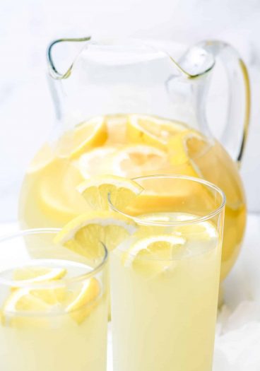 Lemonade Recipe - Refreshing homemade Fresh Lemonade recipe made with fresh lemons! It's a classic delicious drink perfect for any occasion! Makes the perfect cold drink and is such a family favorite! // addapinch.com