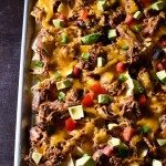 Brisket Nachos make a quick and easy way to repurpose leftover brisket. So simple and so delicious, it will become a favorite! // addapinch.com