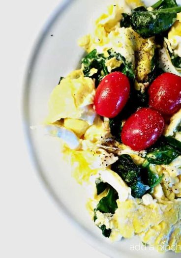 Eggs Spinach and Tomato Scramble Recipe makes a quick and delicious breakfast or brunch! // addapinch.com