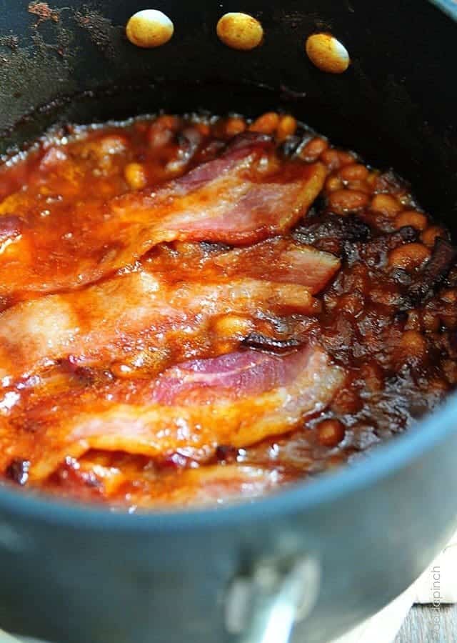 Southern Baked Beans Recipe - This recipe makes the perfect side dish for so many meals! This easy baked beans recipe will become a favorite! // addapinch.com