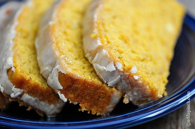 Photograph of slices of pumpkin banana bread on a blue plate.