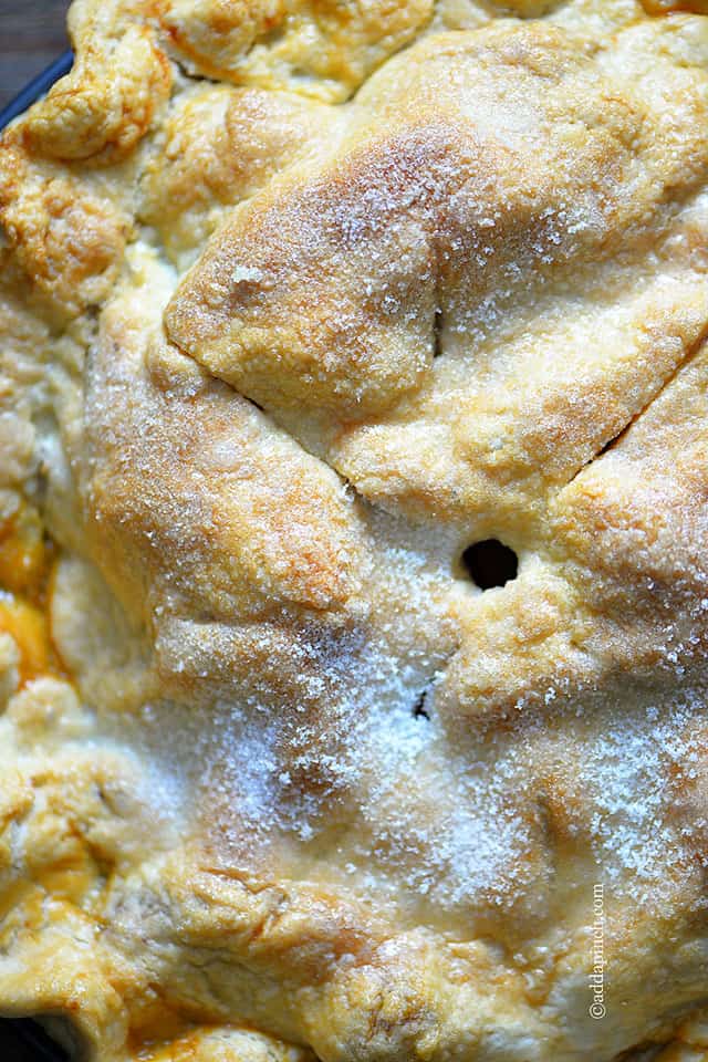 Overhead photo of double crust pie recipe sprinkled with sugar on top.