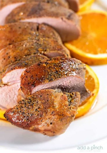 Orange Teriyaki Pork Tenderloin Recipe - This simple orange teriyaki pork tenderloin makes a quick and easy weeknight meal that is also delicious for special occasions. // addapinch.com