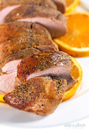Orange Teriyaki Pork Tenderloin Recipe - This simple orange teriyaki pork tenderloin makes a quick and easy weeknight meal that is also delicious for special occasions. // addapinch.com
