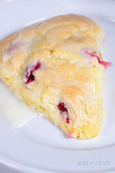 Cranberry Orange Scones make a quick and easy scone recipe perfect for breakfast or brunch. A delicious combination of sweet and tart! // addapinch.com