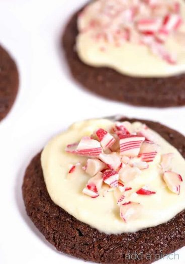 This Peppermint Bark Sugar Cookie recipe make for an easy favorite sugar cookie to serve throughout the holidays and winter! // addapinch.com