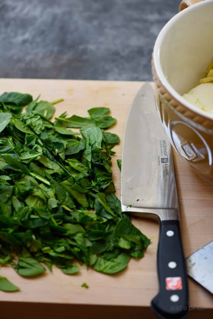 This Hot Spinach Artichoke Dip is so quick and easy! Made of just six ingredients and ready in less than 30 minutes, this spinach artichoke dip is a favorite! // addapinch.com