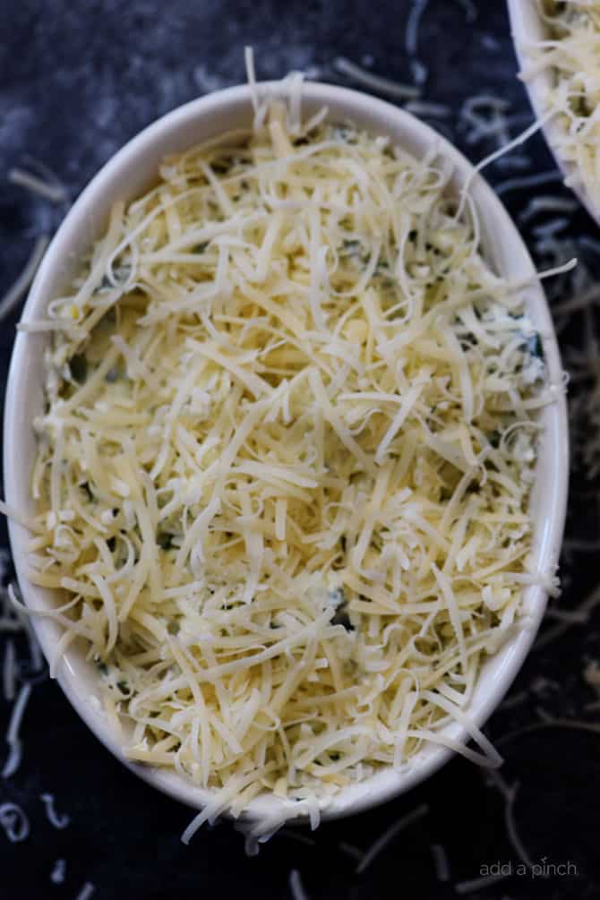 This Hot Spinach Artichoke Dip is so quick and easy! Made of just six ingredients and ready in less than 30 minutes, this spinach artichoke dip is a favorite! // addapinch.com
