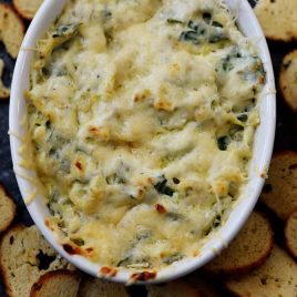 This Hot Spinach Artichoke Dip is so quick and easy! Made of just six ingredients and ready in less than 30 minutes, this spinach artichoke dip is a favorite! // addapinch.com