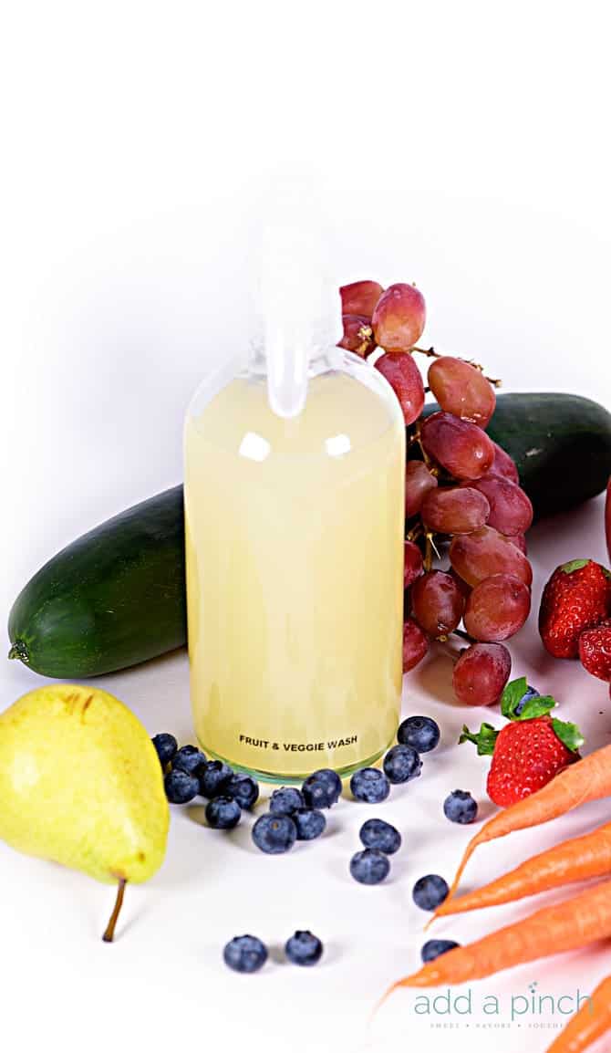 Homemade Fruit and Veggie Wash - An essential, all natural, inexpensive recipe for making your own fruit and veggie wash! Wash away pesticides, dirt, germs and more! // addapinch.com