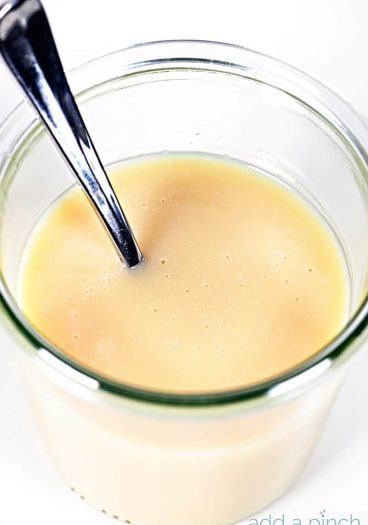 Homemade Sweetened Condensed Milk Recipe - This Homemade Sweetened Condensed Milk recipe makes a delicious, made from scratch version of sweetened condensed milk that you can use in coffee, baking, ice cream and more! // addapinch.com
