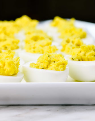 Deviled eggs make the perfect appetizer or side dish for family meals, parties, holidays, potlucks, picnics and more. This simple and classic deviled eggs recipe is a family favorite! // addapinch.com