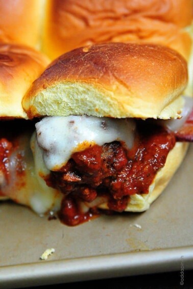 Meatball Sliders make a great appetizer, lunch or even supper! Just be sure to make plenty of these meatball sliders! // addapinch.com