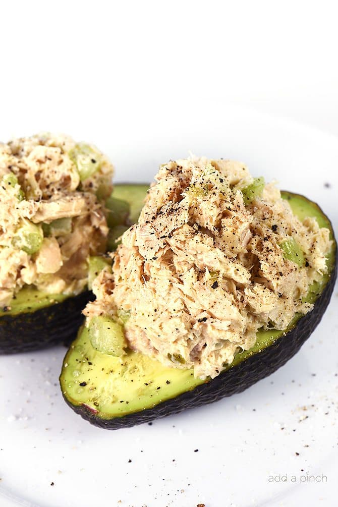 Tuna Salad Recipe - This Tuna Salad recipe makes a delicious, flavorful recipe perfect for lunch or a light supper! Stuffed into an avocado, as a sandwich or served on a lettuce leaf! // addapinch.com