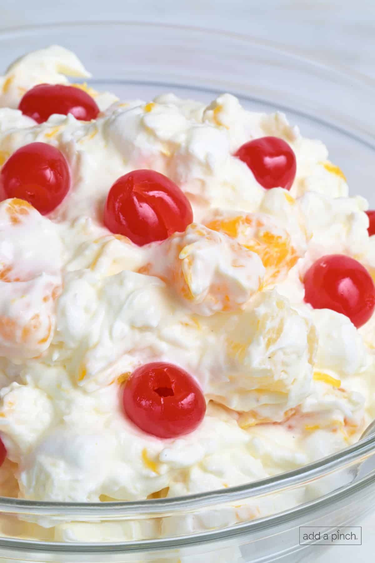 Ambrosia salad in a glass bowl.