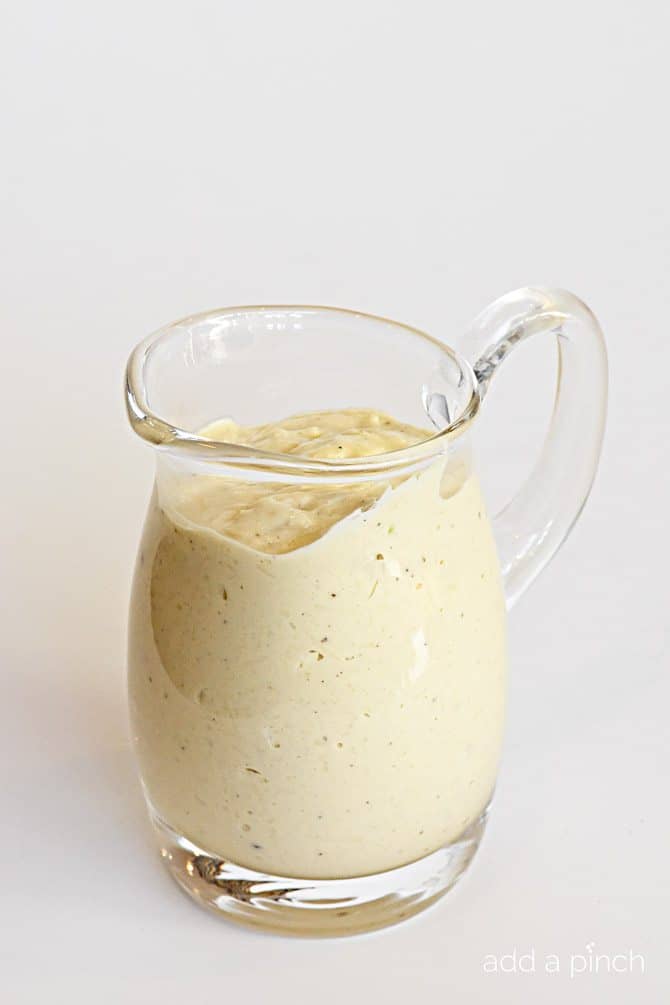 Easy Caesar Salad Dressing - Easy Caesar Dressing is creamy and delicious! A restaurant-style caesar salad dressing made at home! // addapinch.com
