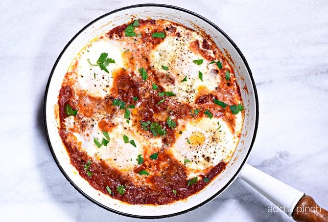 Eggs in Purgatory Recipe - Eggs in Purgatory makes a simple, yet spicy dish for breakfast, brunch, or even a cozy supper. Ready and on the table in less than 30 minutes! // addapinch.com