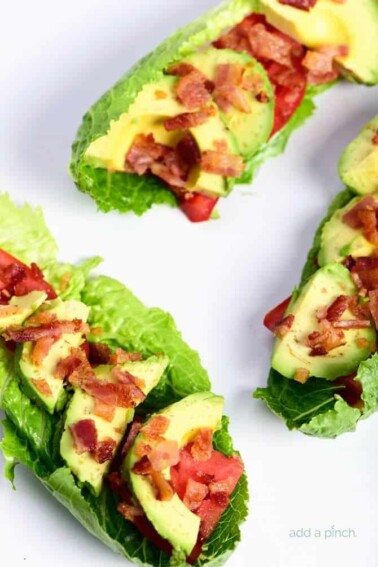 BLT Avocado Lettuce Wraps Recipe - BLT Avocado Lettuce Wraps make a quick, easy and delicious lunch or supper recipe! Perfect to lighten up the favorite BLT combo! // addapinch.com