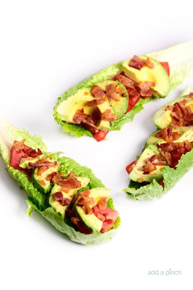 BLT Avocado Lettuce Wraps Recipe - BLT Avocado Lettuce Wraps make a quick, easy and delicious lunch or supper recipe! Perfect to lighten up the favorite BLT combo! // addapinch.com