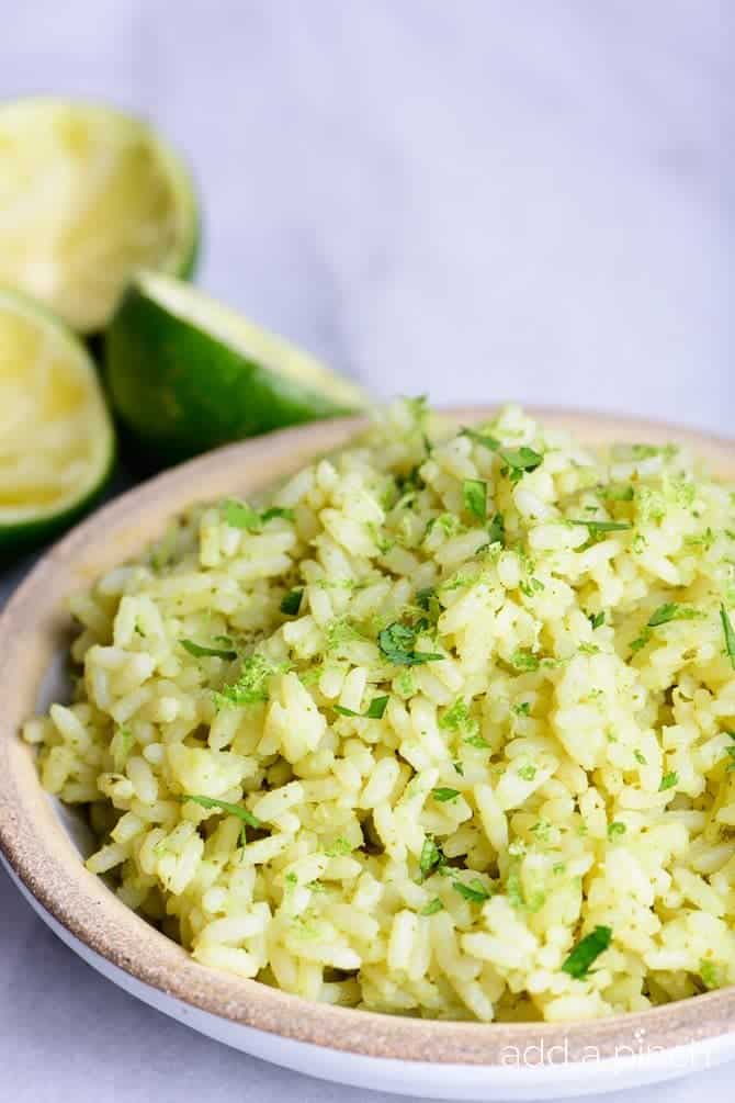 Cilantro Lime Rice Recipe - This Cilantro Lime Rice recipe makes a delicious, flavorful side dish recipe! Pairs perfectly with fish tacos, enchiladas, burritos, or so many other Mexican dishes! // addapinch.com