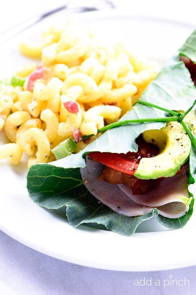 Collard Wrap Recipe - Collard wraps make a fresh, delicious, and nutrient dense way to update your favorite wraps or sandwiches! Made with turkey, bacon, tomato and avocado, these collard wraps are sure to become a favorite! // addapinch.com