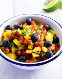 Mango Blueberry Salsa - This Mango Blueberry Salsa makes a fresh fruit salsa recipe perfect for serving with fish, chicken, or on a chip! // addapinch.com