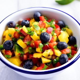 Mango Blueberry Salsa - This Mango Blueberry Salsa makes a fresh fruit salsa recipe perfect for serving with fish, chicken, or on a chip! // addapinch.com