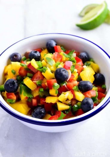 Mango Blueberry Salsa - This Mango Blueberry Salsa makes a fresh fruit salsa recipe perfect for serving with fish, chicken, or on a chip! // addapinch.com