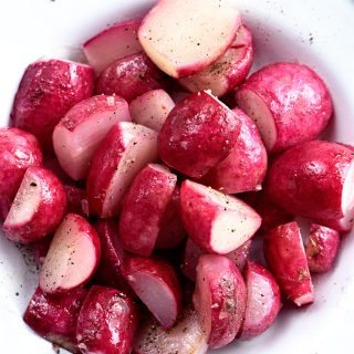 Butter Roasted Radishes Recipe - Roasting radishes makes radishes more mild in flavor, yet rich and delicious! Perfect as a side dish, topping for salads, or a snack! // addapinch.com