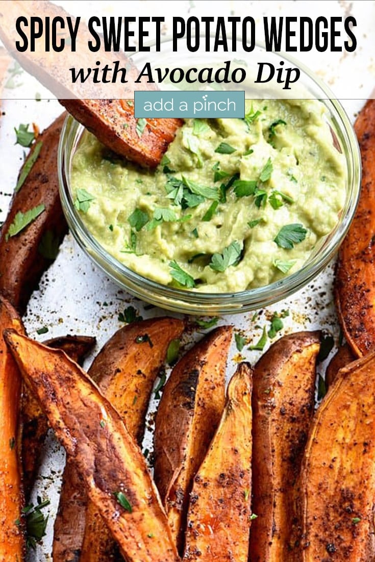 Spicy Sweet Potato Wedges sprinkled with spices with bowl of Avocado Dip - with text - addapinch.com