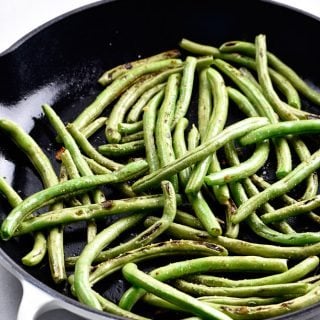 Blistered Green Beans Recipe - These green beans make a quick and easy side dish! Ready in minutes and a delicious favorite! // addapinch.com
