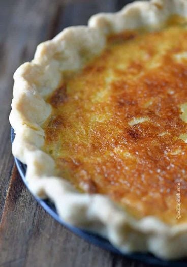 Southern Buttermilk Pie Recipe - Buttermilk Pie is a classic pie recipe well loved for generations in my family. A custardy pie that comes together quickly and easily with a light texture and a slight tangy flavor. // addapinch.com