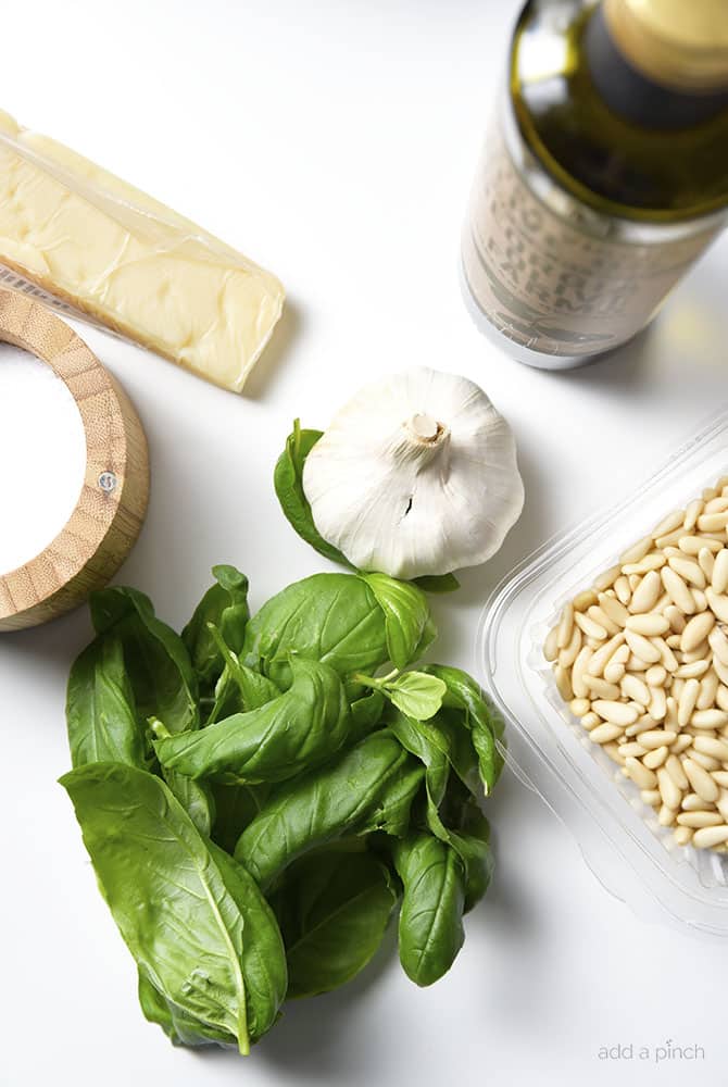 Classic Pesto Recipe - Made of fresh basil, garlic, nuts, olive oil, and cheese, this pesto recipe comes together in minutes and adds so much flavor to so many dishes! // addapinch.com