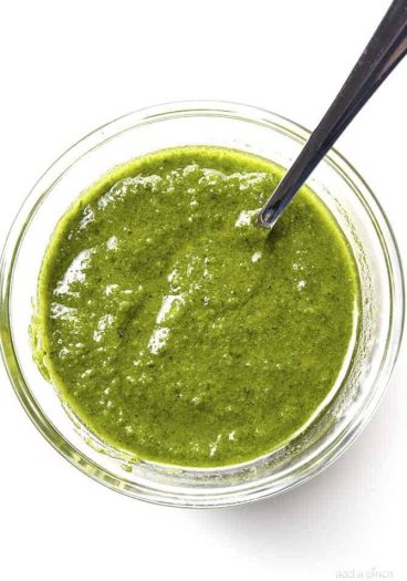 Classic Pesto Recipe - Made of fresh basil, garlic, nuts, olive oil, and cheese, this pesto recipe comes together in minutes and adds so much flavor to so many dishes! // addapinch.com