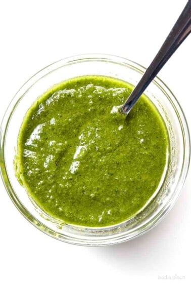 Classic Pesto Recipe - Made of fresh basil, garlic, nuts, olive oil, and cheese, this pesto recipe comes together in minutes and adds so much flavor to so many dishes! // addapinch.com