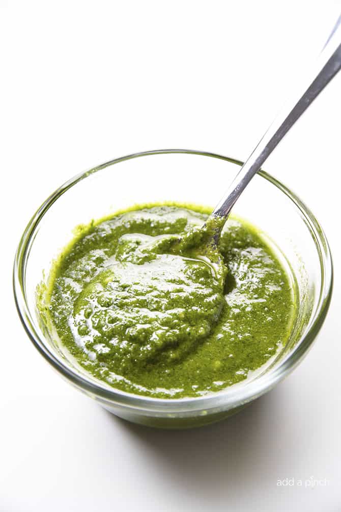 Classic Pesto Recipe - Made of fresh basil, garlic, nuts, olive oil, and cheese, this pesto recipe comes together in minutes and adds so much flavor to so many dishes! // addapinch.com