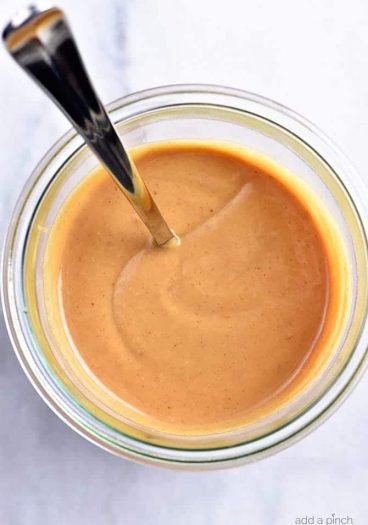 Peanut Sauce Recipe - This easy Peanut Sauce recipe comes together in minutes and is perfect for so many delicious dishes! // addapinch.com