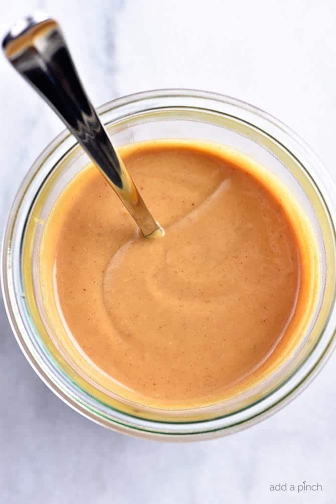 Peanut Sauce in glass jar on marble countertop // addapinch.com