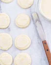 Lemon Shortbread Cookies Recipe - Lemon Shortbread Cookies make a delicious slice and bake cookie recipe perfect for sharing! Made with fresh lemons, this cookie recipe has just the perfect amount of sweet and tart that lemon lovers adore! // addapinch.com