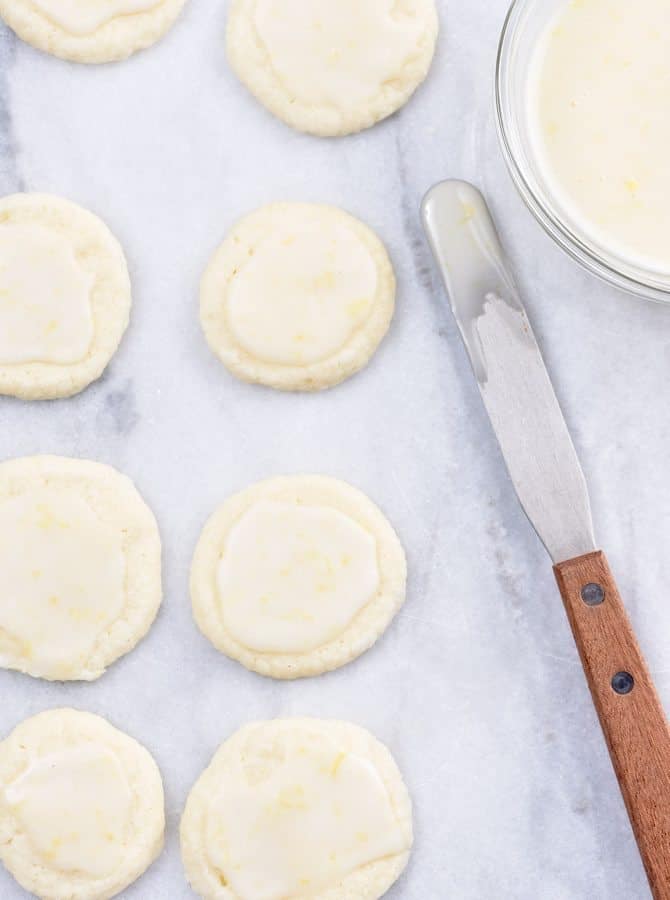 Lemon Shortbread Cookies Recipe - Lemon Shortbread Cookies make a delicious slice and bake cookie recipe perfect for sharing! Made with fresh lemons, this cookie recipe has just the perfect amount of sweet and tart that lemon lovers adore! // addapinch.com