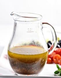 Homemade Italian Dressing Recipe - Homemade Italian Dressing is such a quick and easy salad dressing recipe! Made with olive oil, vinegar, herbs and spices, this Italian Dressing recipe is one that everyone always loves! // addapinch.com