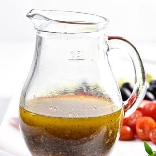 Homemade Italian Dressing Recipe - Homemade Italian Dressing is such a quick and easy salad dressing recipe! Made with olive oil, vinegar, herbs and spices, this Italian Dressing recipe is one that everyone always loves! // addapinch.com