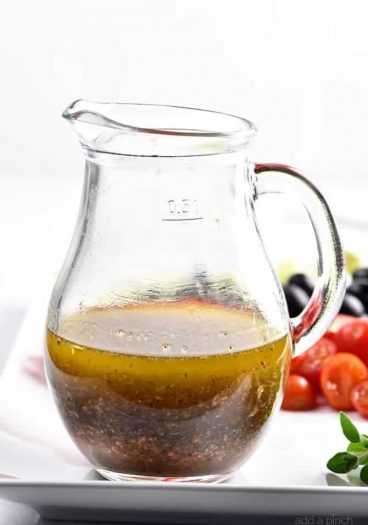 Homemade Italian Dressing Recipe - Homemade Italian Dressing is such a quick and easy salad dressing recipe! Made with olive oil, vinegar, herbs and spices, this Italian Dressing recipe is one that everyone always loves! // addapinch.com