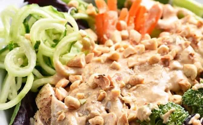 Asian Chicken Salad Recipe - This Asian chicken salad recipe is filled to the brim with flavor! A crisp salad topped with tender chicken, vegetables and a delicious peanut sauce for dressing! // addapinch.com