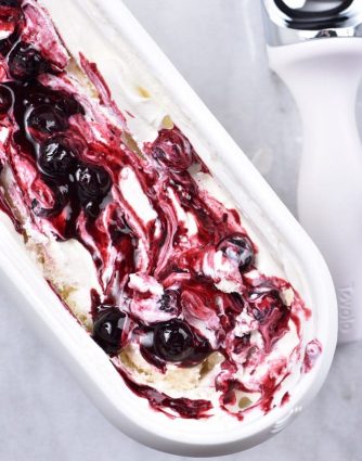 Blueberry Cheesecake Ice Cream Recipe - This Blueberry Cheesecake Ice Cream recipe makes an easy and delicious dessert recipe! A family favorite, this includes a churn and a no-churn ice cream recipe method! // addapinch.com
